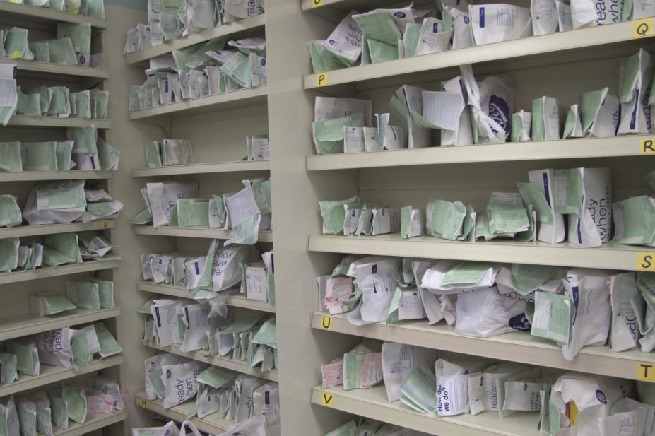 Prescriptions in a pharmacy dispensary ready for collection