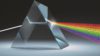 A prism refracts white light into different colours, representing how disclosure of information leads towards transparency