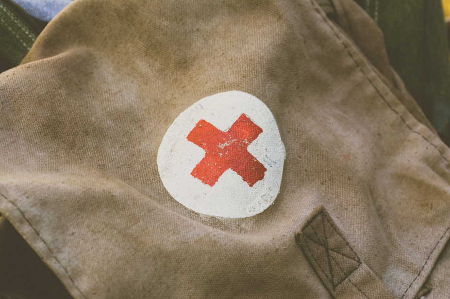 Red cross symbol on military bag