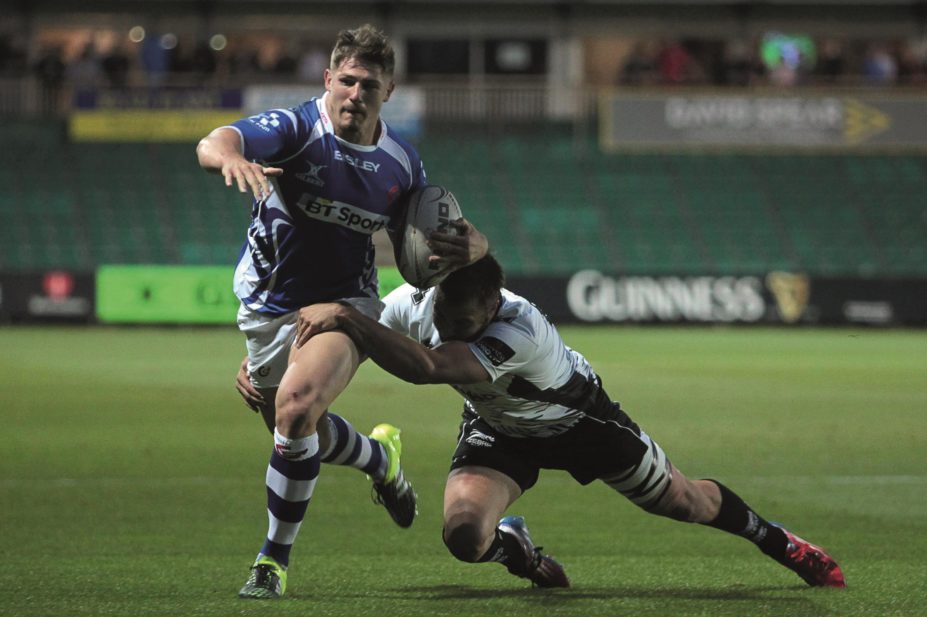 Ross Wardle of Newport Gwent Dragons is tackled by Ulrich Beyers of Zebre