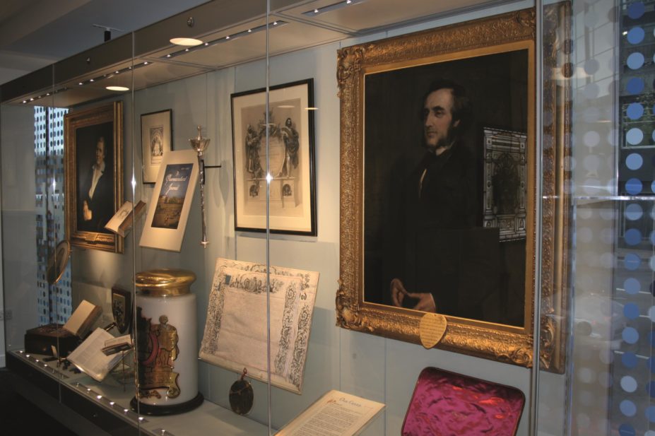 Founding and evolution of the Royal Pharmaceutical Society cabinet containing the RPS charter and an original portrait of Jacob Bell, among others