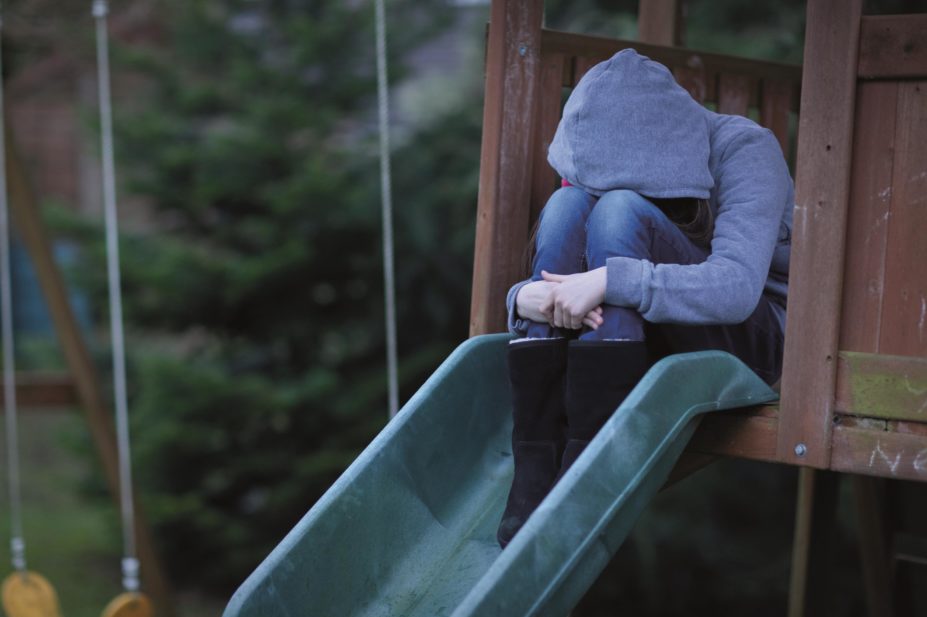 Children and adolescents who take the most common antidepressants are twice as likely to experience aggression and suicide as those not exposed to the drugs, according to a review by Cochrane researchers. In the image, sad child in playground