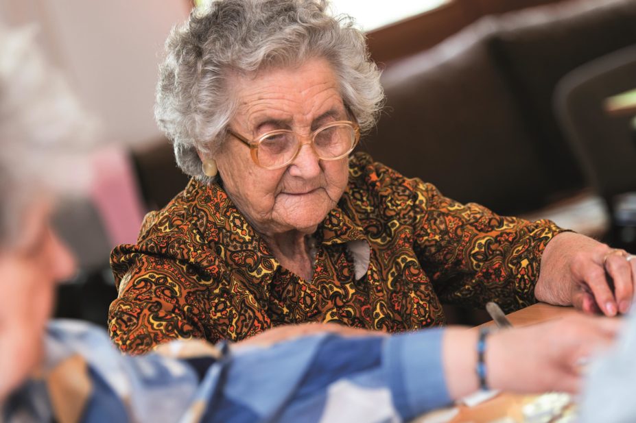 Researchers found that stopping antihypertensive treatment in older patients with mild cognitive deficits does not slow their cognitive function. In the image, an elderly woman