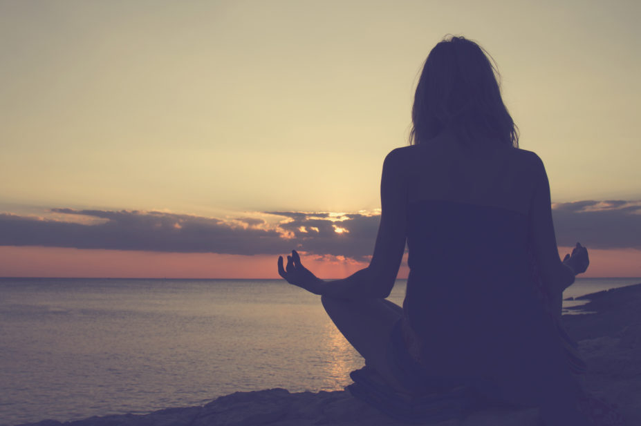 woman sitting meditating mindfulness