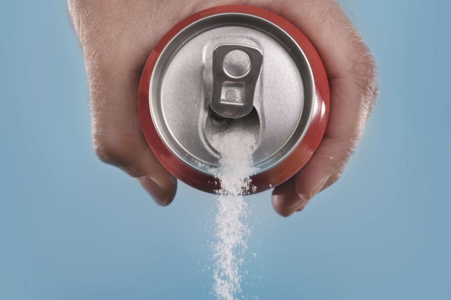 Around 300,000 people in the UK could avoid diabetes if the sugar in soft drinks was reduced by 40% over the next five years, according to a study. In the image, an opened soda can pouring out sugar