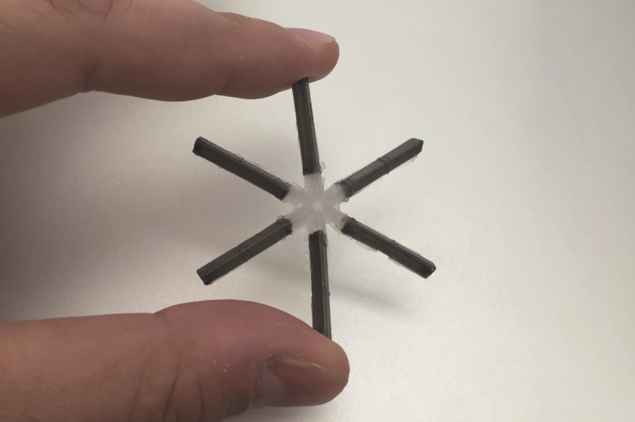 A close up of the star-shaped long-lasting drug device