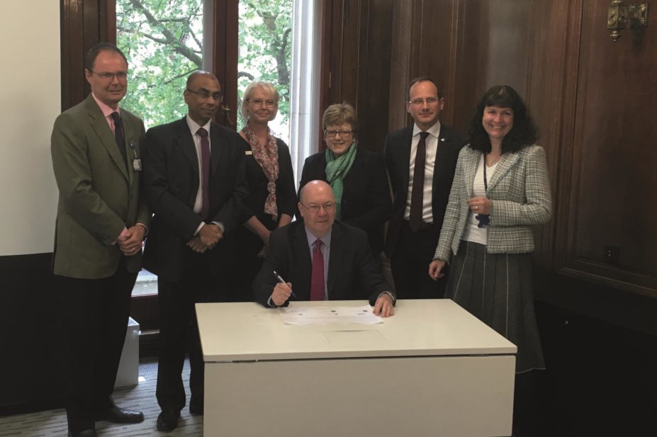 Signatories to the STOMPLD pledge, from left to right (back): Matt Hoghton; Ashok Roy; Ann Norman; Sandra Gidley; Peter Kinderman; Hazel Watson; front, Alistair Burt MP