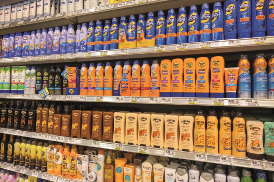 he Royal Pharmaceutical Society calls on sunscreen manufacturers to adopt single sun protection rating after survey reveals public confusion. In the image, rows of different sunscreen bottles in a supermarket