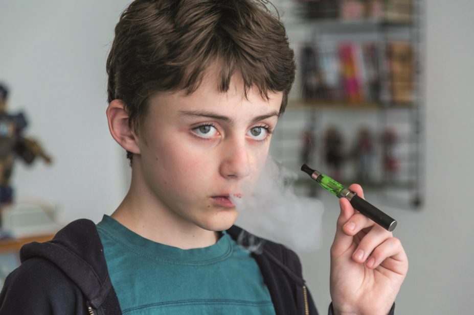 Study reveals that 5.8% of primary-school children (10–11 years) and 12.3% of secondary school children (11–16 years) have used e-cigarettes. In the image, a young boy uses an e-cigarette