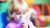 Toddler with inhaler mask