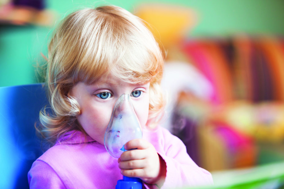 Toddler with inhaler mask