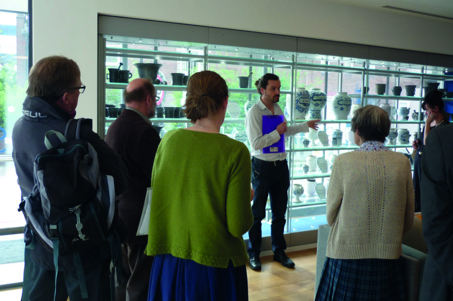 John Betts, curator of the Museum of the RPS, speaks with tour delegates
