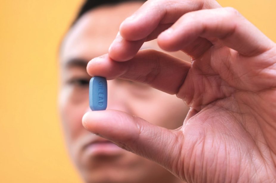 Offering men who have sex with men antiretroviral therapy as pre-exposure prophylaxis (PrEP) is necessary if the UK is to achieve a marked reduction in the annual rate of HIV infections by the end of 2020. Pictured, a man holds up a PrEP (Truvada) pill