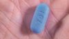 Research found that pre-exposure prophylaxis, taken at the time of sexual activity, reduced the risk of HIV transmission by 86% compared with placebo among men who have sex with men. In the image, close up of Truveda pill used for pre-exposure prophylaxis