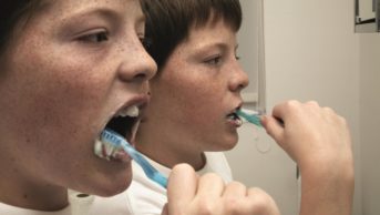 Cochrane reviewers have found little or no good-quality evidence to prove xylitol, a natural sweetener found in sugar-free chewing gums and tooth pastes, has a protective effect against tooth decay. In the image, twin boys brushing their teeth