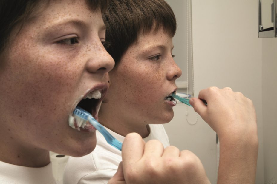 Cochrane reviewers have found little or no good-quality evidence to prove xylitol, a natural sweetener found in sugar-free chewing gums and tooth pastes, has a protective effect against tooth decay. In the image, twin boys brushing their teeth
