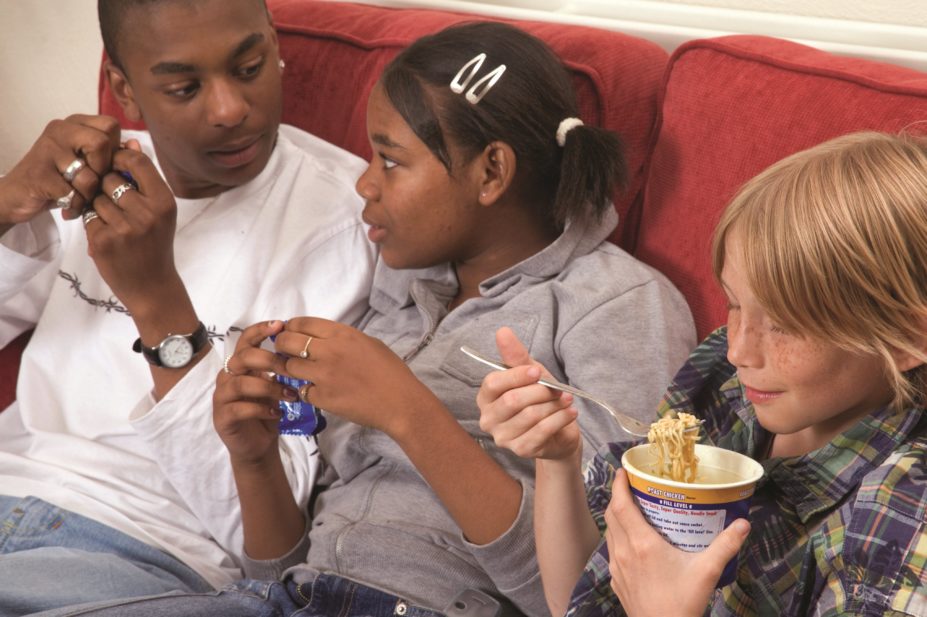 Teenagers eating ultra-processed food