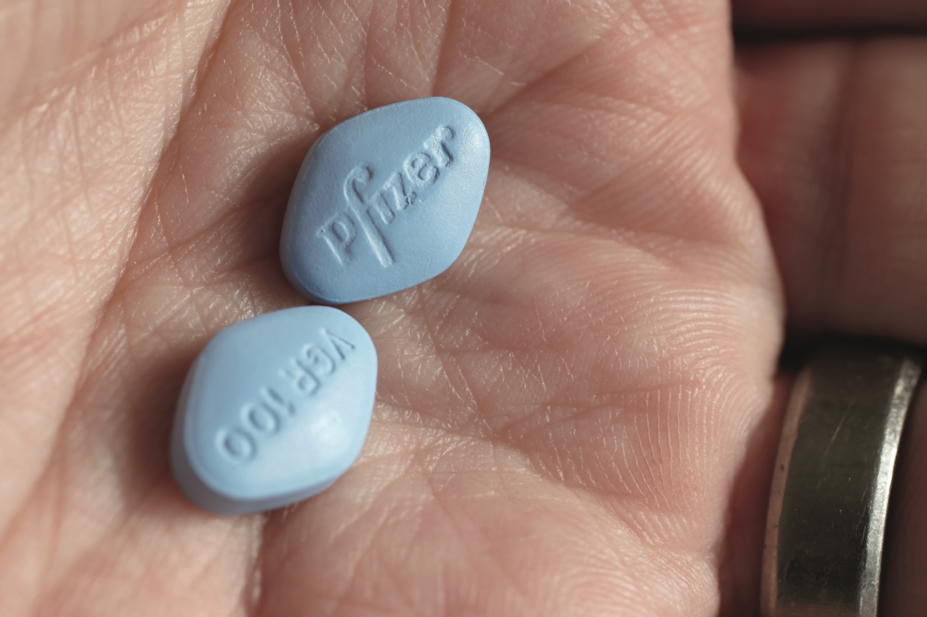 Close up of viagra pills on the palm of a hand