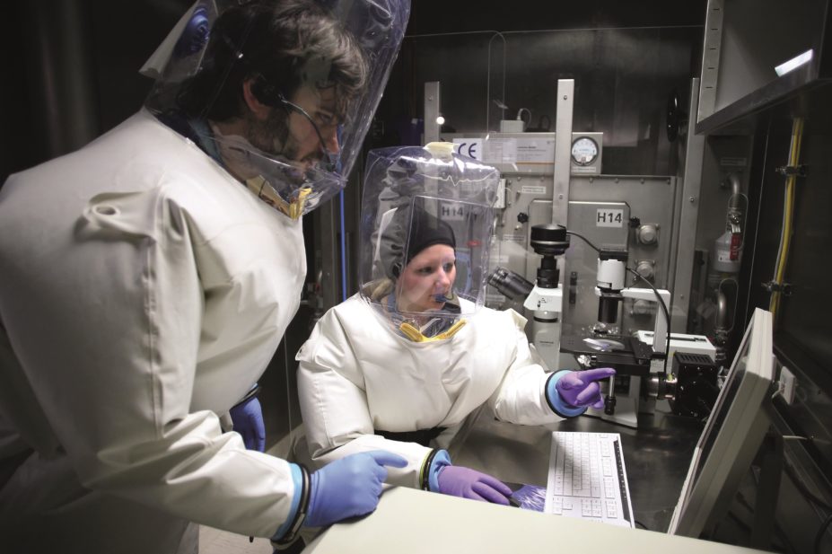 Virologists researching on the ebola virus in a laboratory