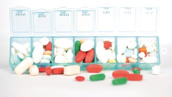 There are many reasons why patients do not take their medicines as prescribed. Discovering the specific cause of non-adherence is the best way to improve it. In the image, a weekly pill box full of medicines