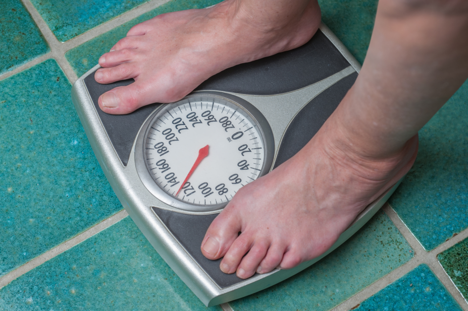 Person standing on bathroom scales