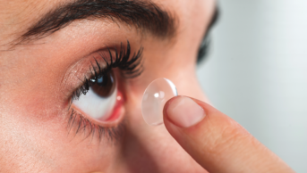 woman applying contact lens eye ss 17