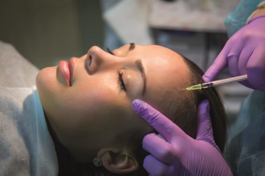 Pharmacists who want to offer non-surgical facial dermal fillers and Botox will have to complete a postgraduate level qualification, according to recommendations by Health Education England. In the image, a woman receives botox injections