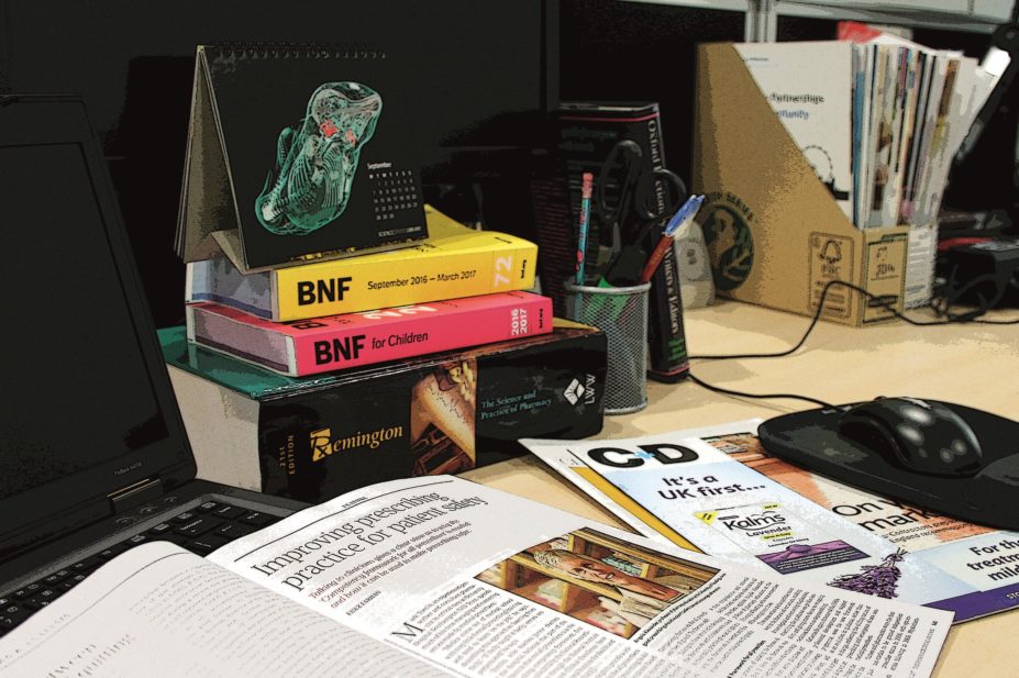 A writers' desk with different pharmacy-related magazines and publications