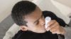 Thousands of patients with asthma in the UK are not being prescribed the right medication to keep their condition under control, finds an audit of GP practice records by the charity body Asthma UK. In the image, a boy uses an asthma inhaler