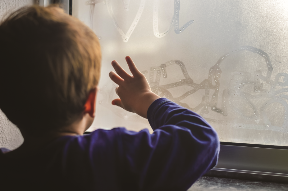 young child drawing on window ss 17
