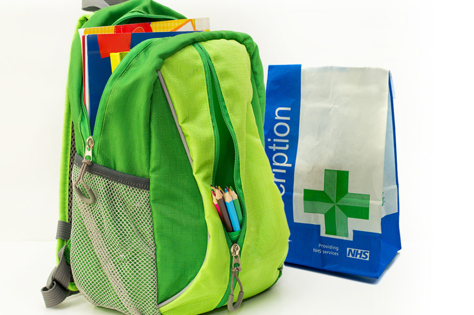 child's backpack next to prescription bag