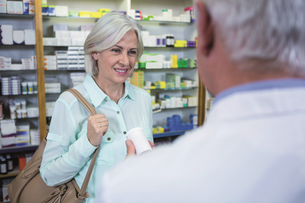 Senior woman speaks to a pharmacist about menopause