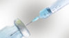 vaccine drawing solution out of vial
