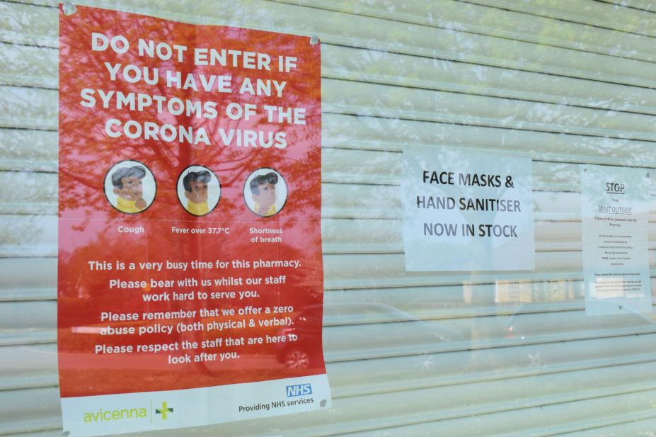 Coronavirus notice in a pharmacy window