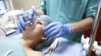 anasethetist preparing patient for surgery