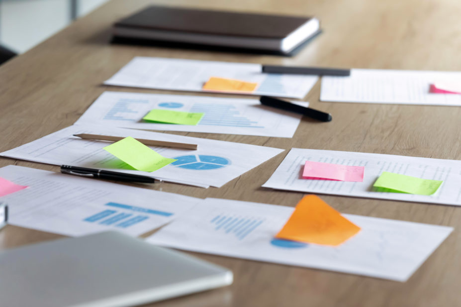 Close up paper marketing research reports on table