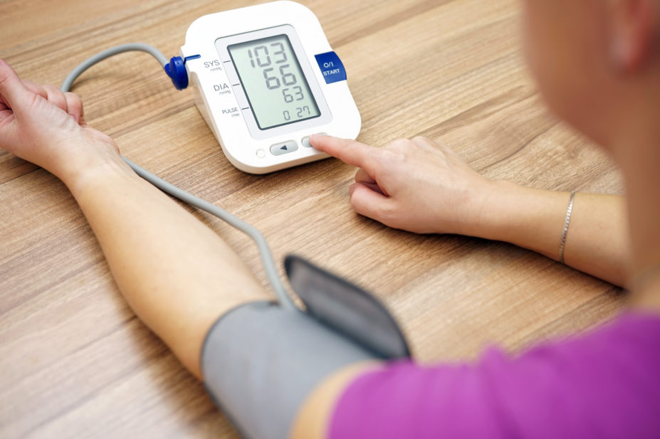 Woman reading her blood pressure