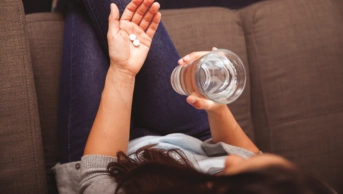 woman taking tablets