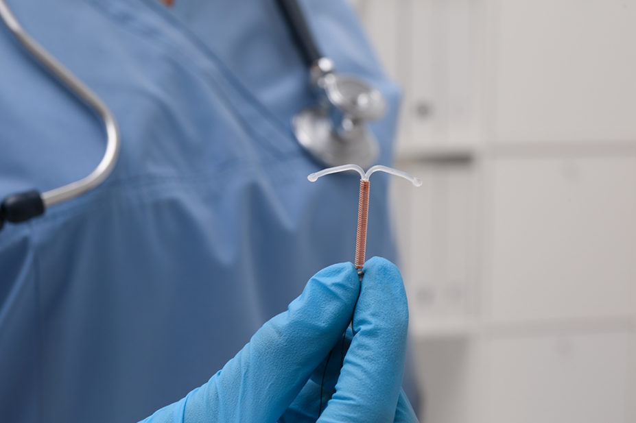 Doctor holding intrauterine device