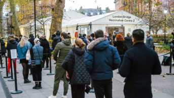 A long queue of people at London Bridge Vaccination Centre, Guy's Hospital, central London