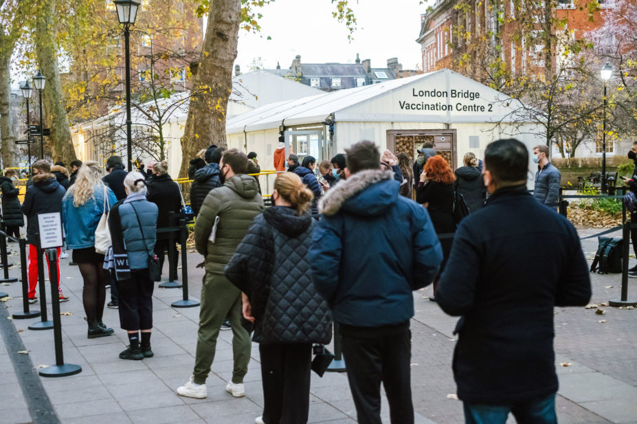 A long queue of people at London Bridge Vaccination Centre, Guy's Hospital, central London