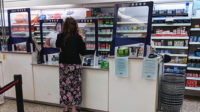 A woman in a community pharmacy
