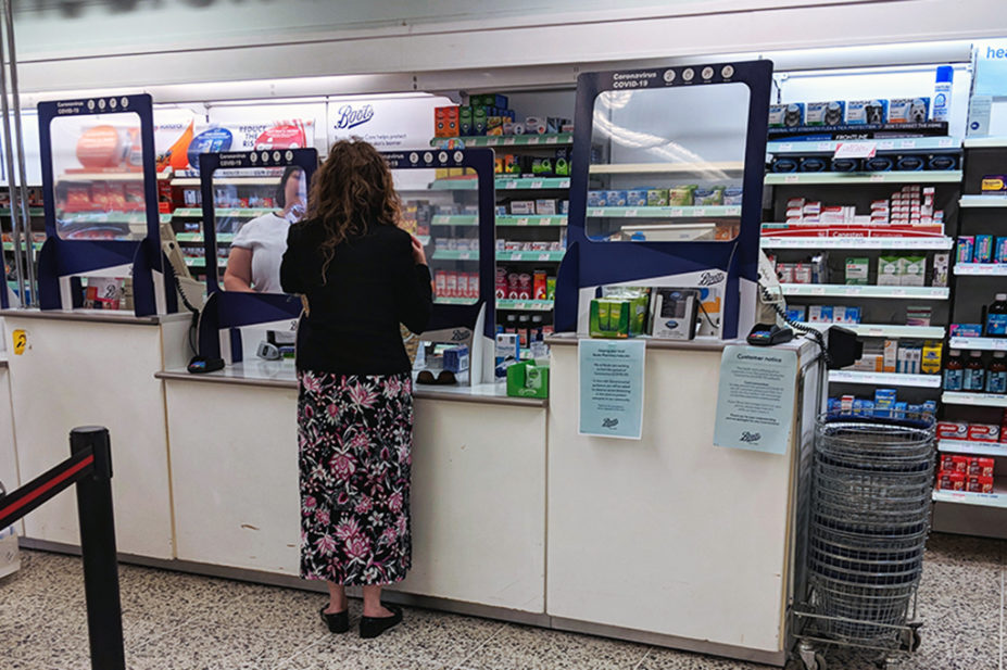 A woman in a community pharmacy