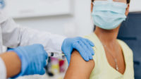 healthcare professional giving vaccination