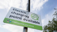 Sign for a electric charging point in a car park, England