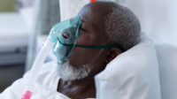 male patient wearing ventilator in hospital