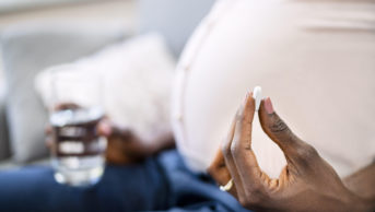 pregnant woman taking tablet