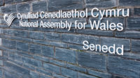Sign on the wall of the National Assembly of Wales building