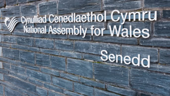 Sign on the wall of the National Assembly of Wales building