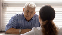 older man in consultation with pharmacist